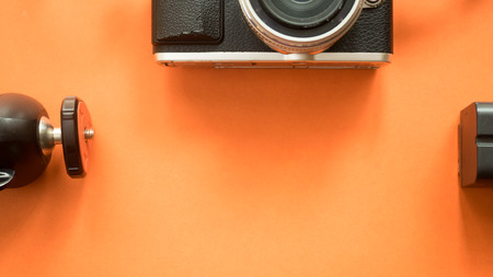 Camera Accessories close up copyspace on orange backgroundの写真素材