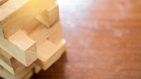 Wooden block game tower on wood background close upの写真素材