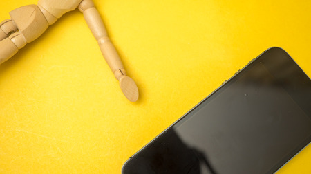 smartphones  with wooden dummy
