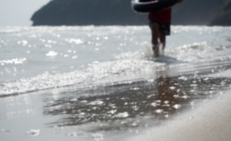 Children play in the seaの写真素材