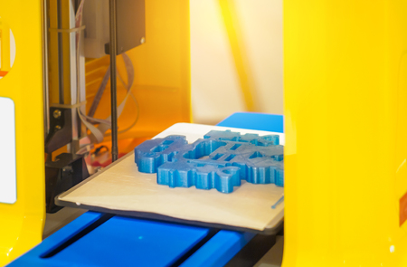 Automatic three dimensional 3d printer performs product creation. Modern 3D printing or additive...