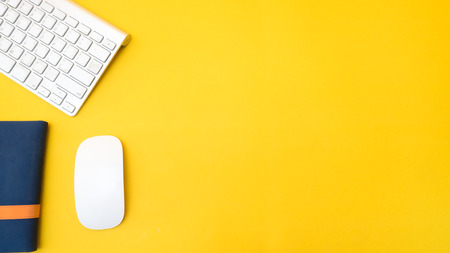 Office desk table Top view  copy space yellow backgroundの写真素材