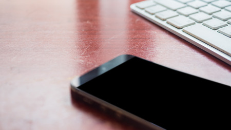 smartphone on keyboard close up