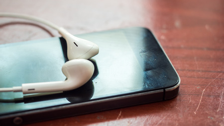 earphone on smartphone close upの写真素材