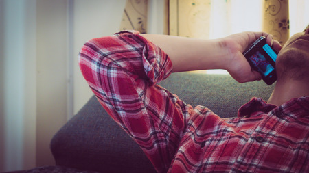 Young  hipster man working in homeの写真素材