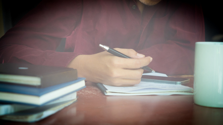 Young man sitting in a office working for successの写真素材