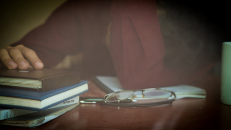 Young man sitting in a office working for successの写真素材