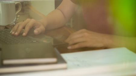 Young man sitting in a office working for successの写真素材