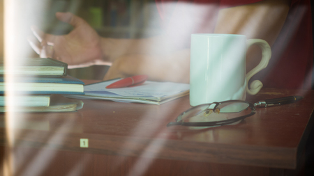 Young man sitting in a office working for successの写真素材