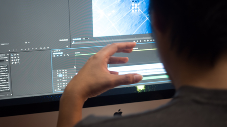 Young business man working with computer in officeの写真素材