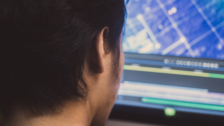 Young business man working with computer in officeの写真素材