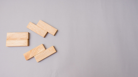 Wood block stacking arrow symbol.Business concept on gray backgroundの写真素材