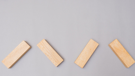 Wood block stacking arrow symbol.Business concept on gray backgroundの写真素材