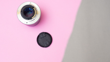 lens on color paper geometric flat lay backgroundの写真素材