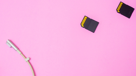 sd card  and charge on pink backgroundの写真素材