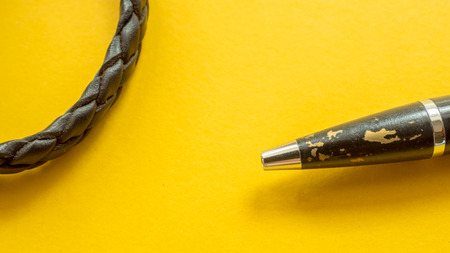 close up pen on yellow backgroundの写真素材