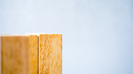arranging wood block stacking.Business concept on gray backgroundの写真素材
