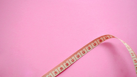 tape measure copy space on pink background