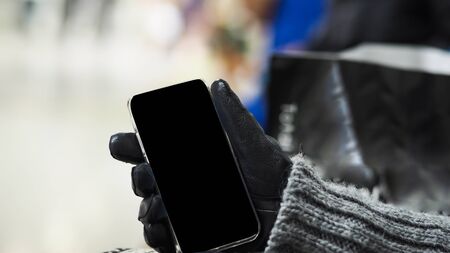 Woman hand holding the white smartphoneの写真素材