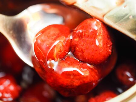 homemade strawberry jam in a glass close upの写真素材