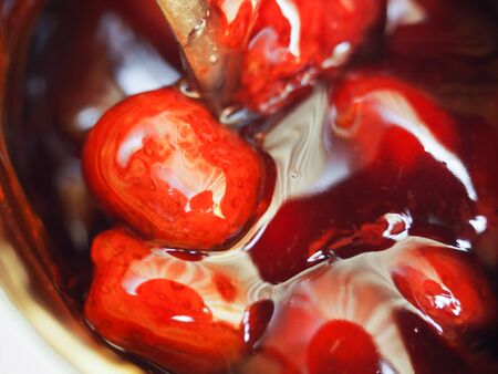 homemade strawberry jam in a glass close upの写真素材
