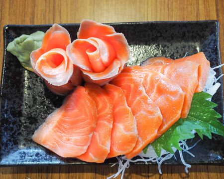 Salmon in a black dish, Japanese foodの写真素材