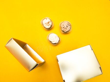 chocolate homemade and gift box on yellow backgroundの写真素材