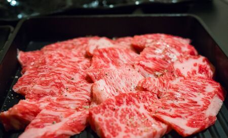 Japanese raw kobe beef on black backgroundの写真素材