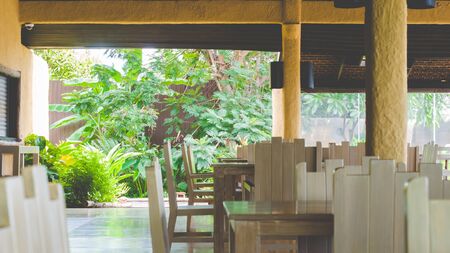 White chairs for dining in the gardenの写真素材