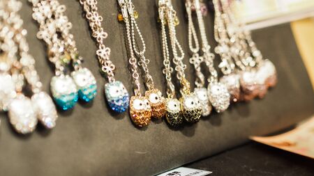 Traditional japan necklaces, handmade souvenirs at marketplace.の写真素材