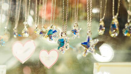 Star shaped gold necklace and bokehの写真素材