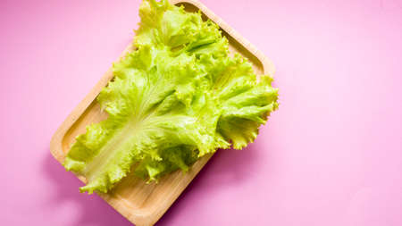 Green vegetables on pink backgroundの写真素材