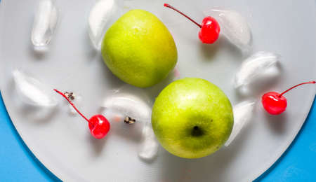 green apple with cherry top viewの写真素材