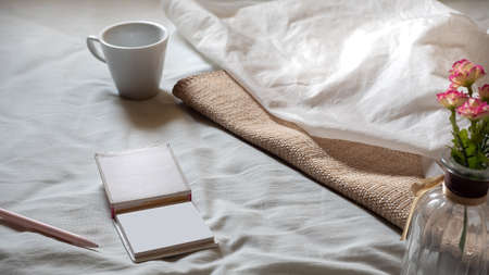 Cloth with flower vase and coffee cup, soothing note paper.Relax contentの写真素材