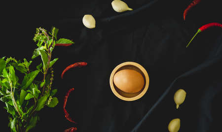 Chicken eggs, garlic and spices top viewの写真素材