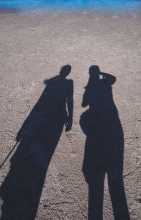 Shadows of man and woman  on the sea beach in sunny weather
Keywords:の写真素材