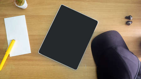 Work online station for social media content with tablet and earphone, digital web internet...