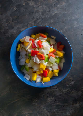 Still life of three color peppers on dark backgroundの写真素材