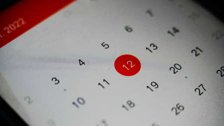 Mobile Calendar in smarth phone with hand close upの写真素材