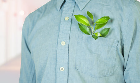 Men in business shirts have leaves in their pockets representing nature's work in saving the environment.business nature conceptの写真素材