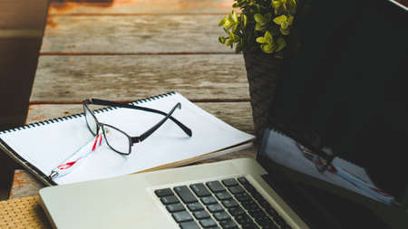 Leaves nature and computer keyboard with glasses.Technology with nature green concept