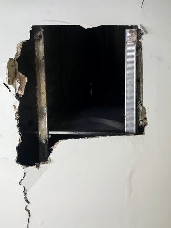Ceiling panels damaged huge hole in roof from rainwater leakage. Water damaged ceiling