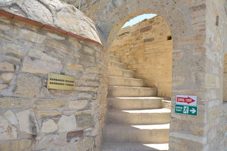 CESME, TURKEY - JULY, 13, 2018: Old Ottoman Cesme Castle and some historical pieces shows on case. Cesme is popular tourist destination in Izmir Province.のeditorial素材