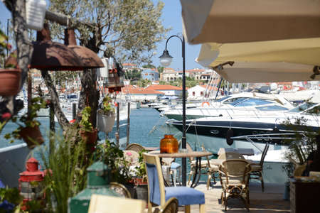 CESME, TURKEY - JULY, 13, 2018: Cesme Marina street view in Cesme Town. Cesme is popular tourist...