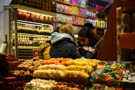 ISTANBUL, TURKEY, MARCH 14, 2019: People walking and shopping inside the Spice Bazaar (Egyptian Carsisi) one of the largest bazaars in the city. Located in the Eminonu quarter of the Fatih district.のeditorial素材