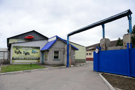 ZAPORIZHIA, UKRAINE - MARCH 24, 2019: The enterance of faeton museum of old retro vintage technology, cars and vehicles with cars, toys, bicycles and posters.のeditorial素材