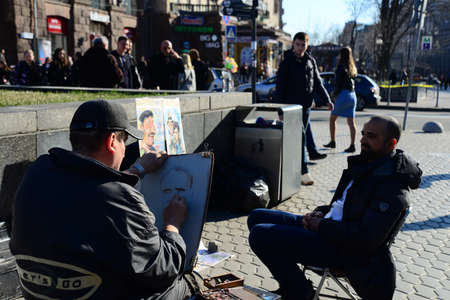 Ukraine, Kiev - APRIL 5, 2019: Street Musician on the Tchaikovsky National Academy of Music (or Kiev Conservatory) is a Ukrainian state institution of higher music education in Kievのeditorial素材