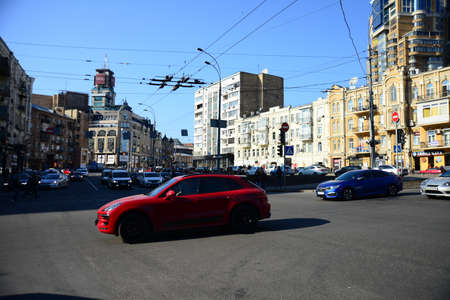 KYIV, UKRAINE - APRIL 10, 2019: Cars drive on Baseina street