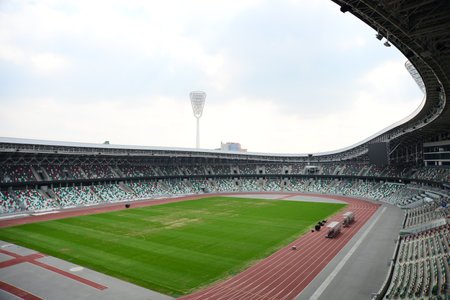 MINSK, BELARUS - APRIL 15, 2019: New building of DINAMO stadium prepared for second European Games in Minsk on the sunset. New special lighting equipment near the stadium.のeditorial素材