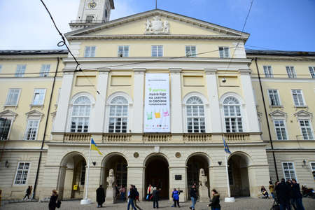 LVIV, UKRAINE - APRIL 17, 2019: View of Lviv City Hall (built in 1830 - 1845) with 65 m height tower, situated at Market Square (Rynok Square). Rynok Square in Lviv - city central squareのeditorial素材
